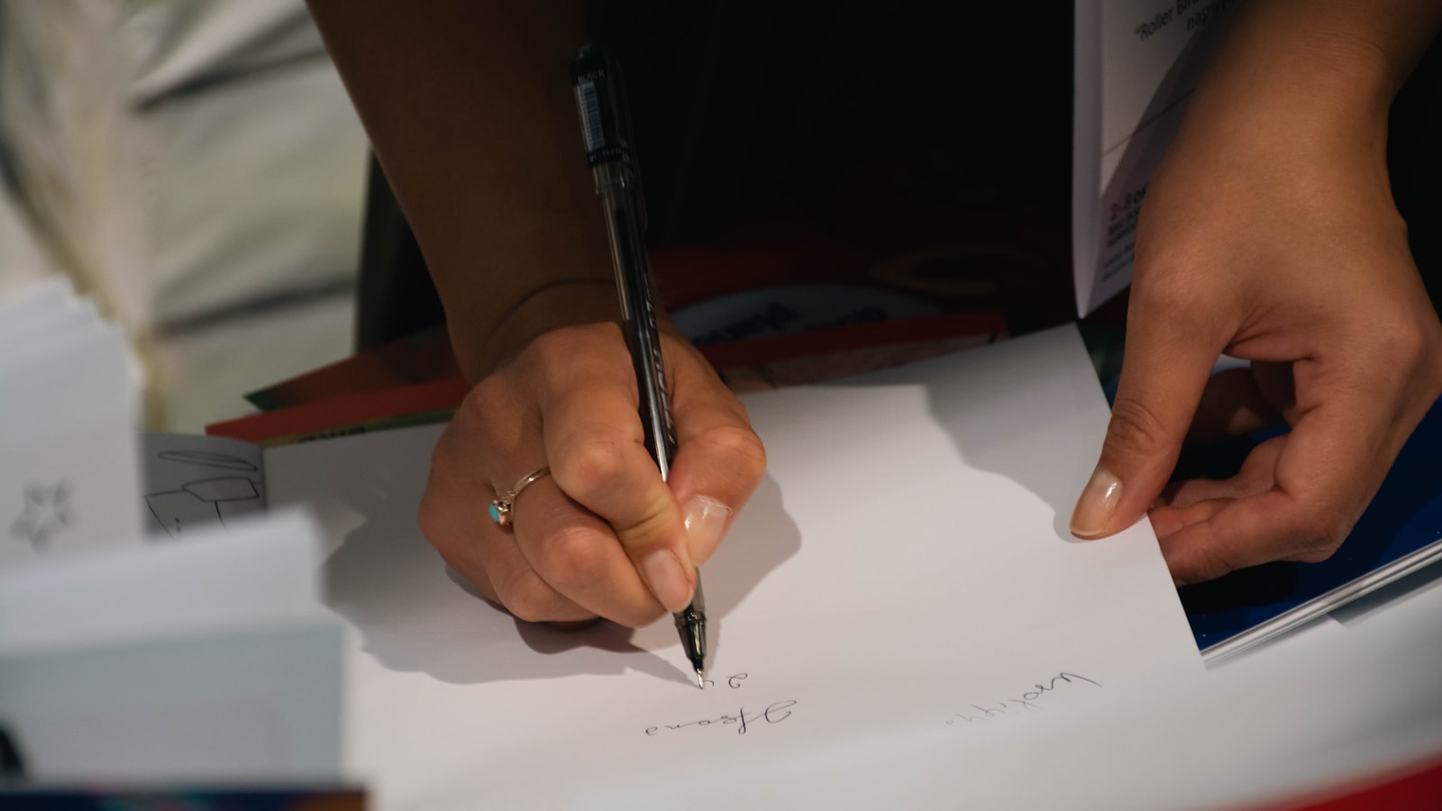 A student writing corrections by hand