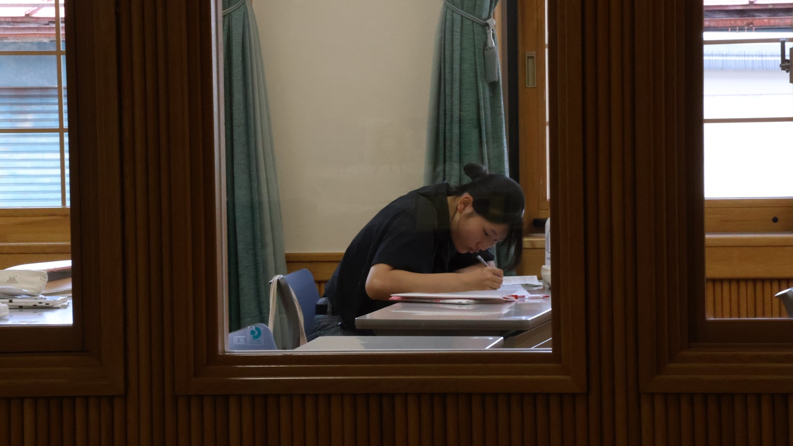 A student studying intently at a desk